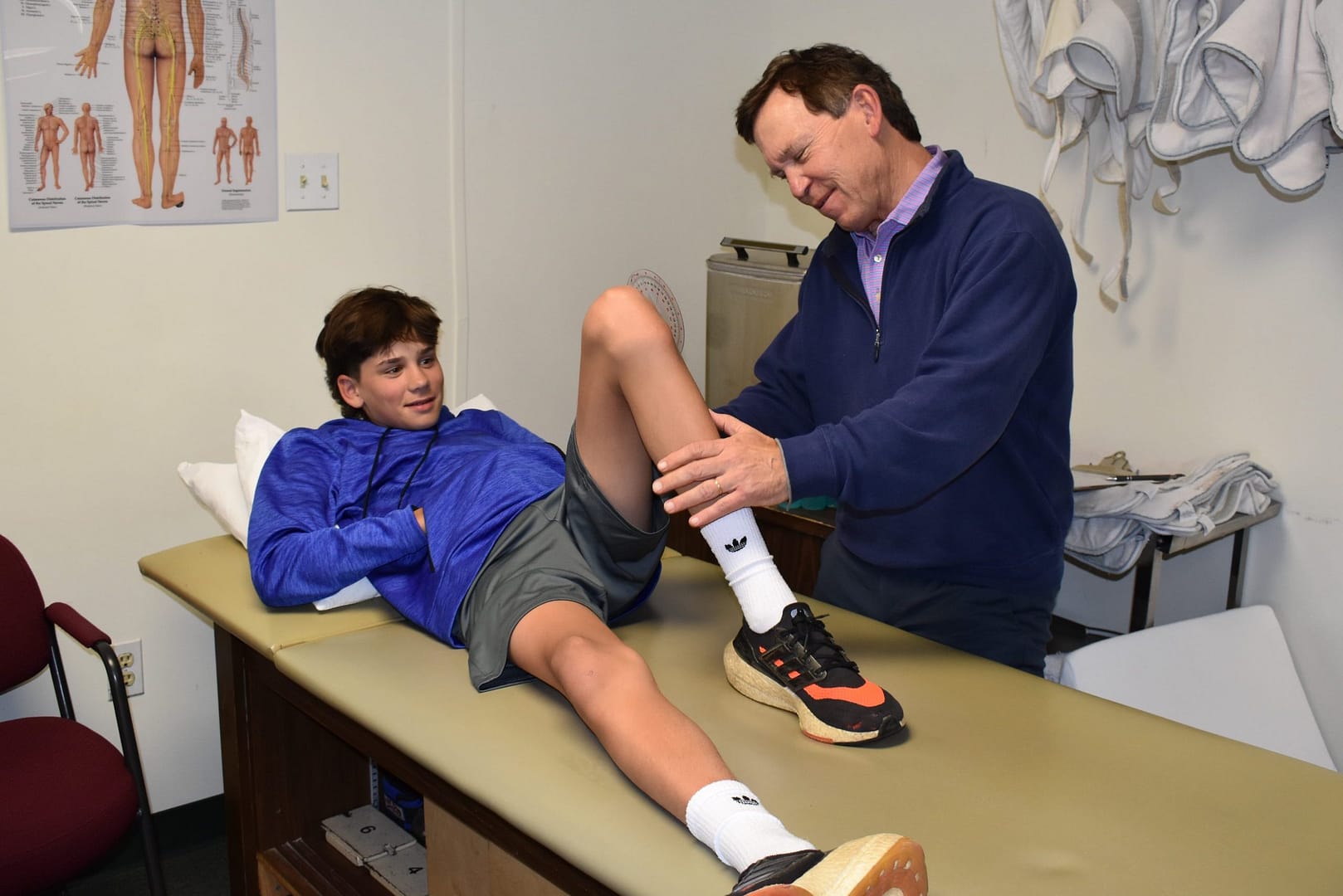 client undergoing evaluation after sports injury